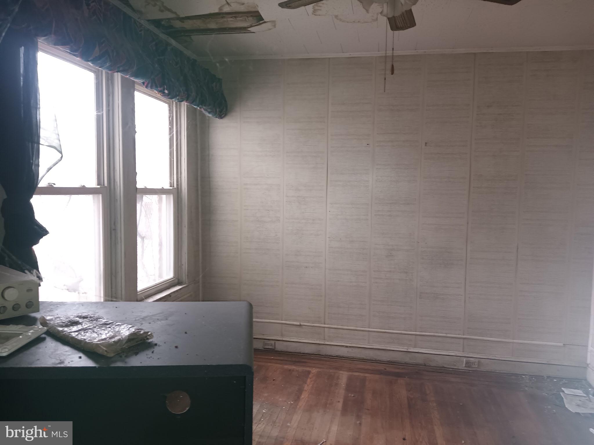 2908 Baker Street Baltimore, MD 21216 - Photo 4 of 15 a bathroom with a granite countertop sink and window