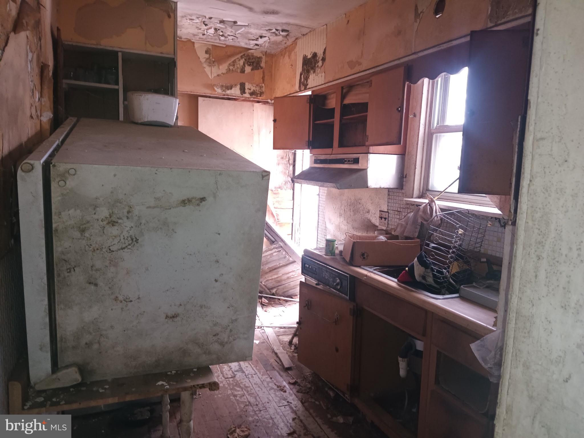 2908 Baker Street Baltimore, MD 21216 - Photo 6 of 15 a bathroom with a sink and a mirror