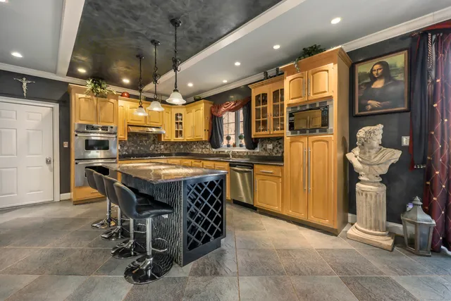 a kitchen with a table and chairs