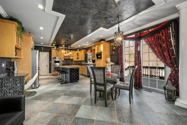 a room with lots of chairs and mirrors