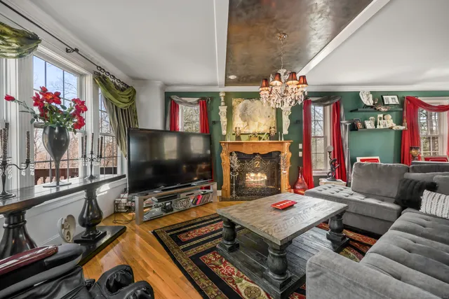 a living room with furniture and a flat screen tv
