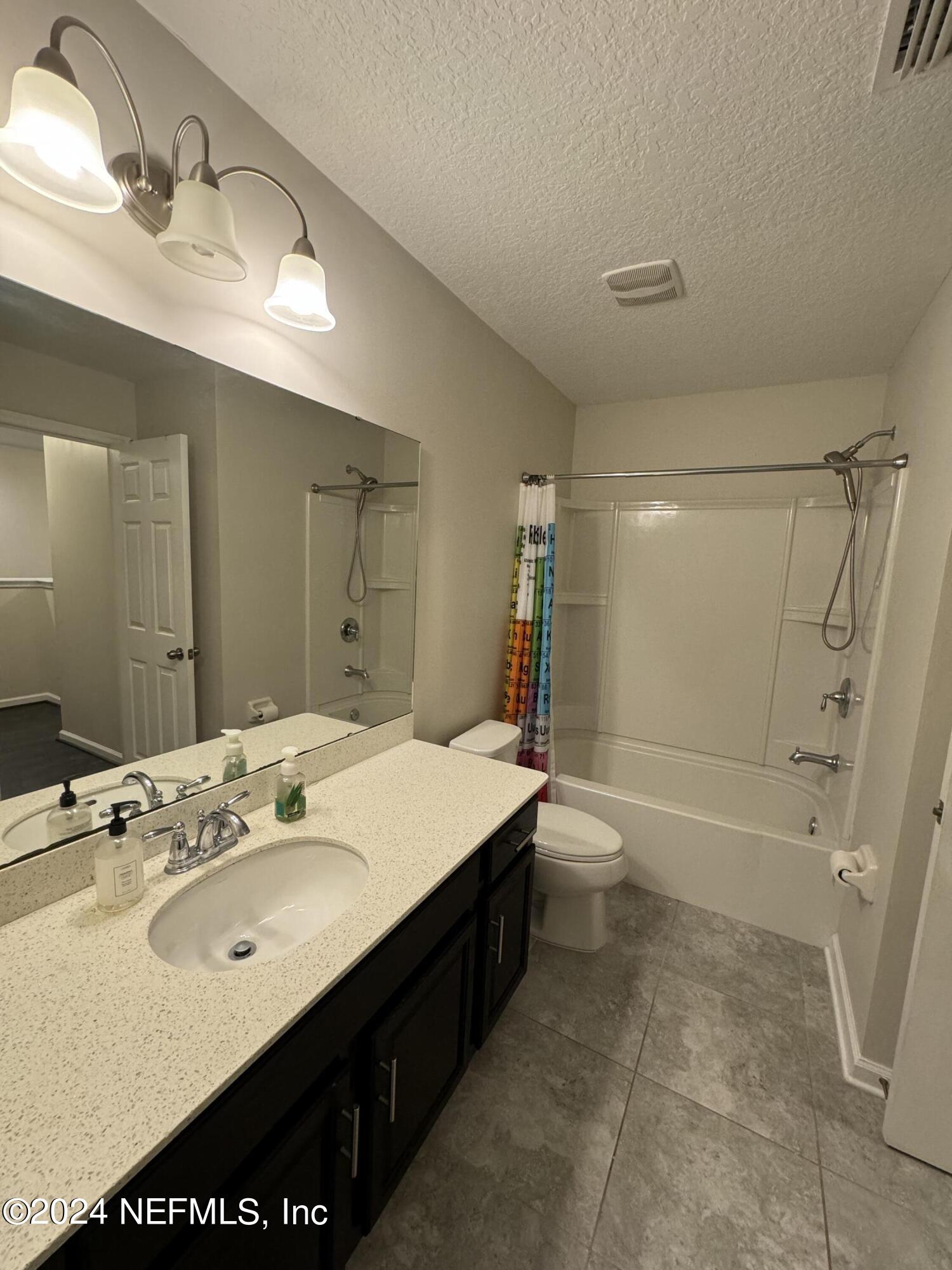 144 Nelson Lane St. Johns, FL 32259 - Photo 14 of 18 a bathroom with a sink a toilet and shower