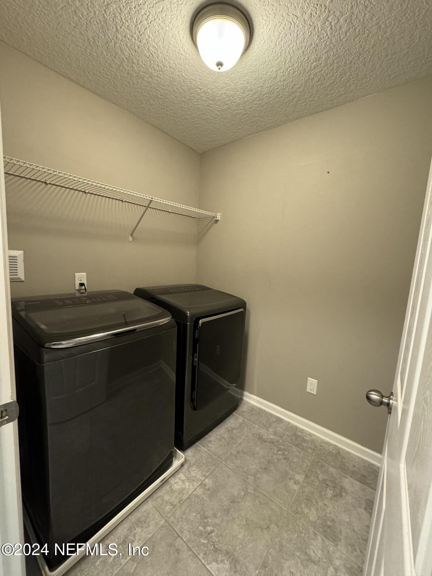 144 Nelson Lane St. Johns, FL 32259 - Photo 15 of 18 a utility room with dryer and washer