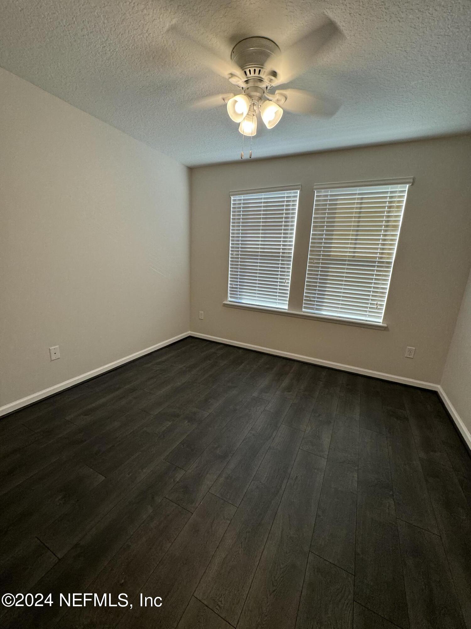 144 Nelson Lane St. Johns, FL 32259 - Photo 18 of 18 an empty room with wooden floor and windows