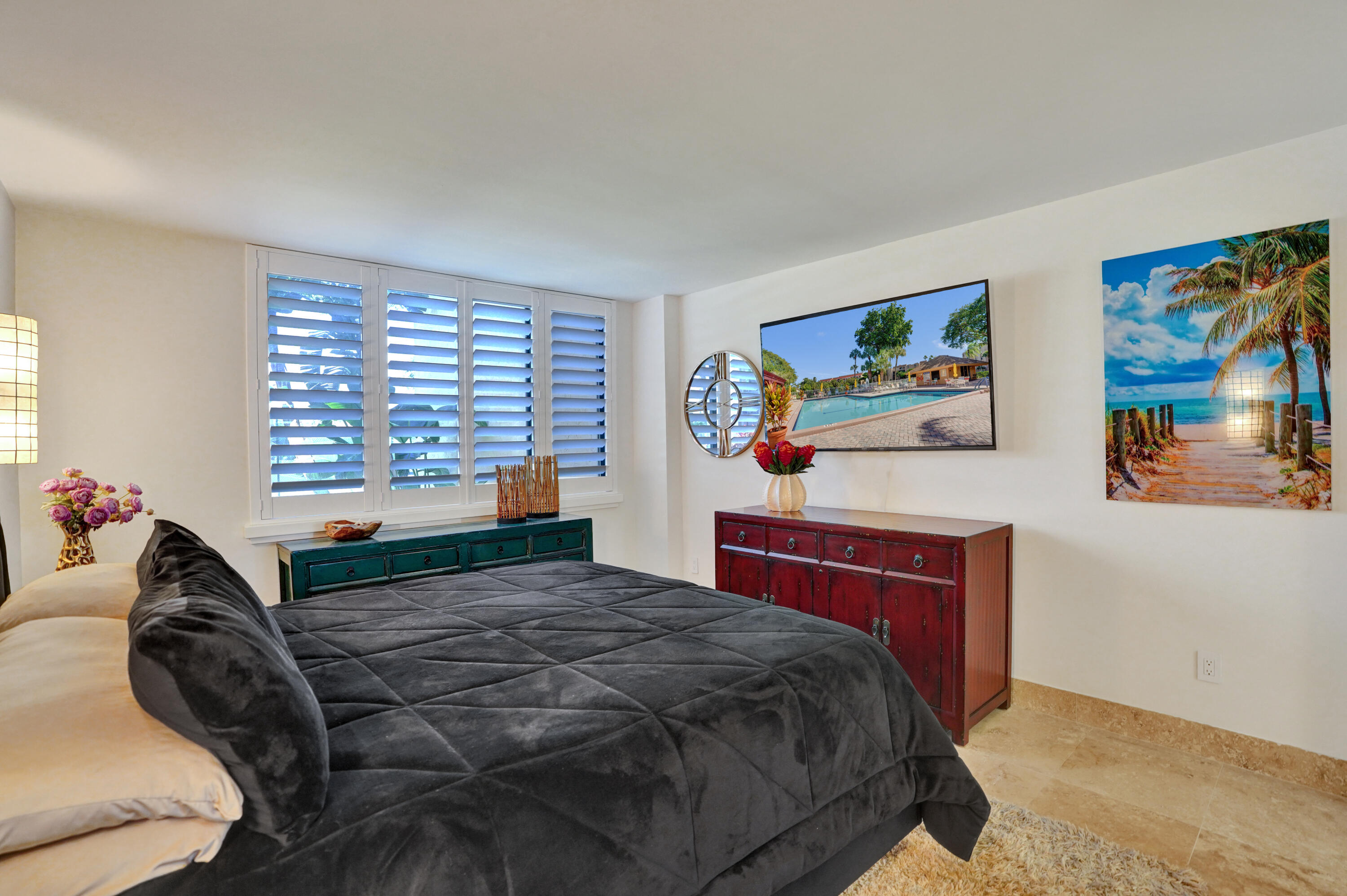 755 Dotterel Road, Unit 1112 Delray Beach, FL 33444 - Photo 22 of 64 a bedroom with a large bed and a window
