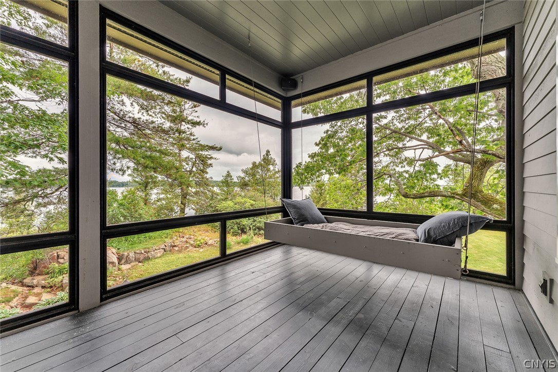 48992 Sylvan Alexandria, NY 13607 - Photo 26 of 50 screened porch off Kitchen above lower level bedrooms
