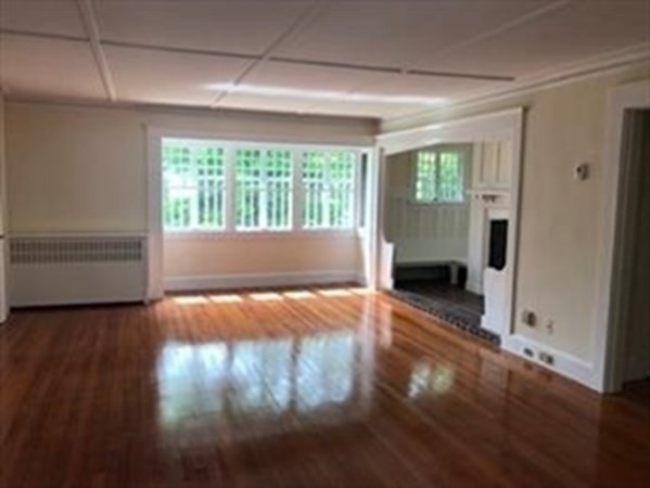 19 Homestead Road, Unit 1 Wellesley, MA 02482 - Photo 23 of 32 a view of empty room with wooden floor and fan