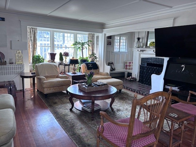 19 Homestead Road, Unit 1 Wellesley, MA 02482 - Photo 30 of 32 a living room with fireplace furniture and a flat screen tv