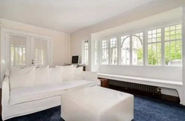 a bathroom with a bathtub and a large window