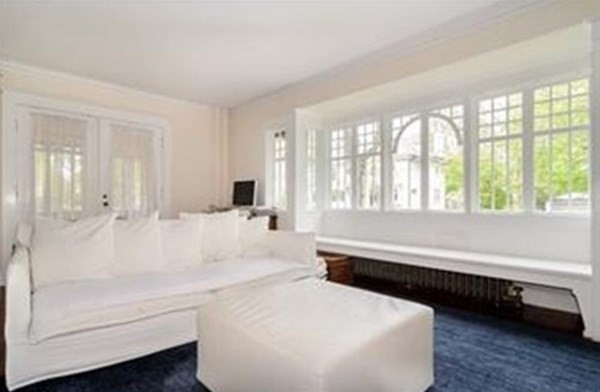 19 Homestead Road, Unit 1 Wellesley, MA 02482 - Photo 5 of 32 a bathroom with a bathtub and a large window