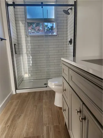 a bathroom with a toilet a sink and bathtub