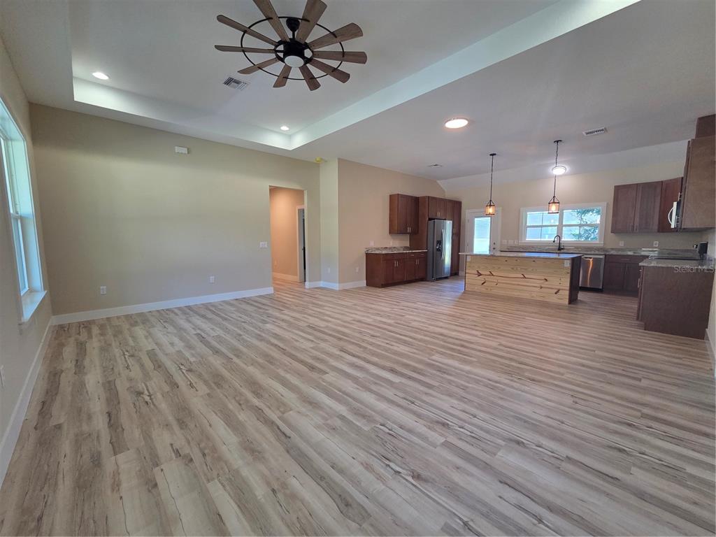 8005 North Terrel Point Citrus Springs, FL 34434 - Photo 16 of 41 a view of a kitchen with a sink and dishwasher with wooden floor