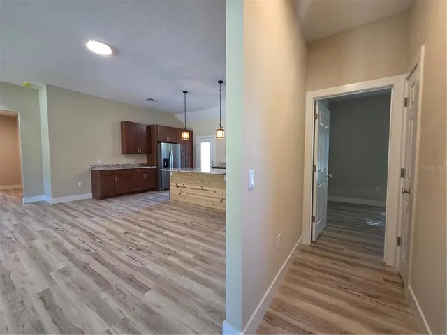 a bathroom with a sink mirror vanity and toilet