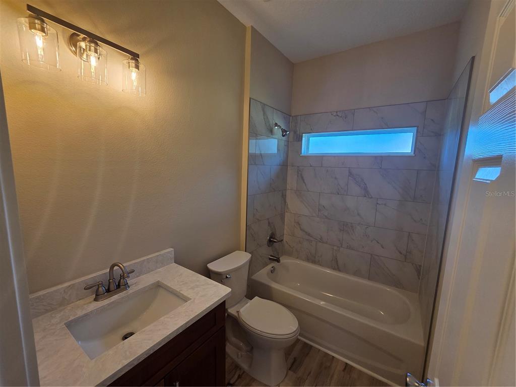 8005 North Terrel Point Citrus Springs, FL 34434 - Photo 26 of 41 a bathroom with a sink mirror vanity and toilet