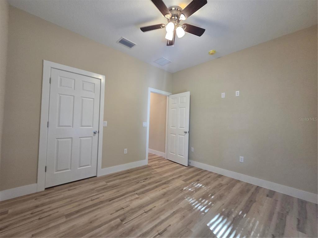 8005 North Terrel Point Citrus Springs, FL 34434 - Photo 28 of 41 a view of an empty room and wooden floor