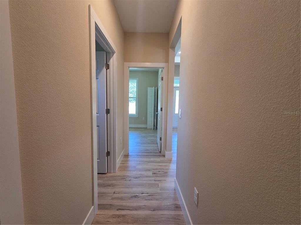 8005 North Terrel Point Citrus Springs, FL 34434 - Photo 29 of 41 a view of a hallway with wooden floor