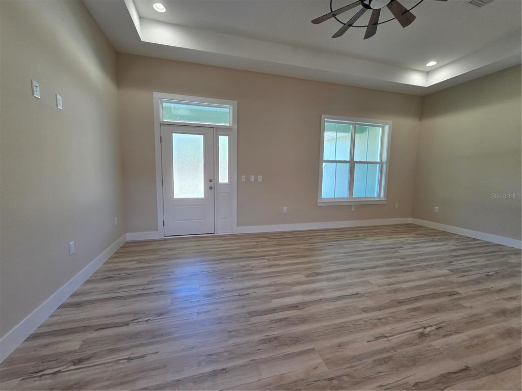 8005 North Terrel Point Citrus Springs, FL 34434 - Photo 31 of 41 a view of empty room with wooden floor and fan