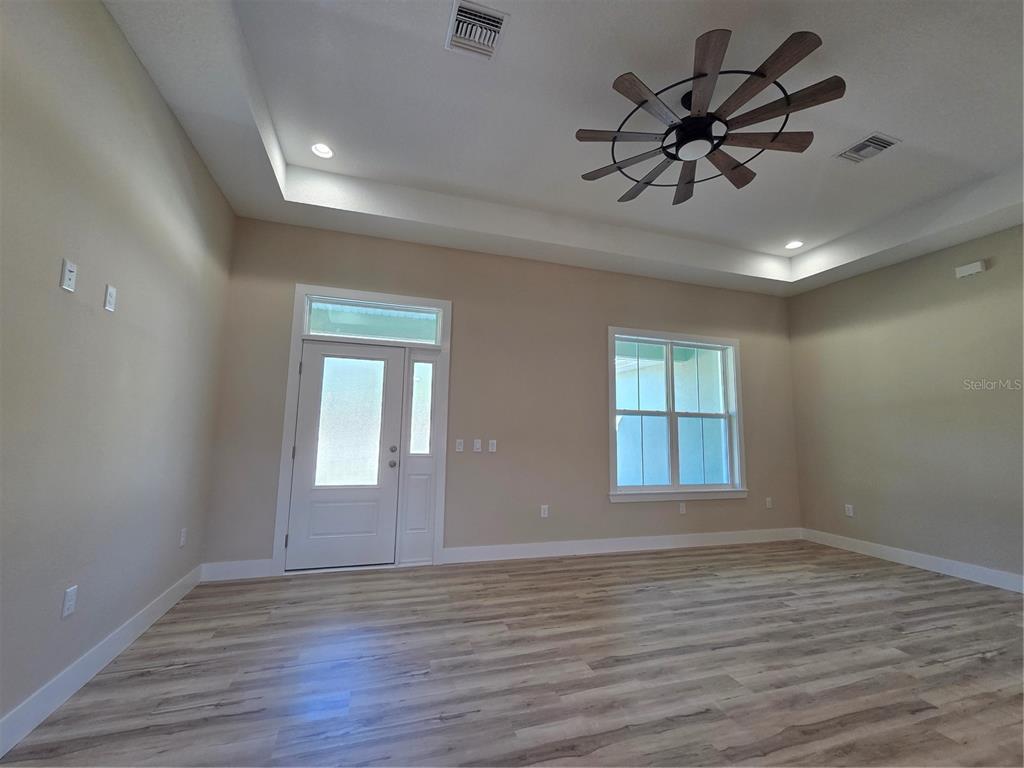 8005 North Terrel Point Citrus Springs, FL 34434 - Photo 32 of 41 a view of empty room with wooden floor and fan