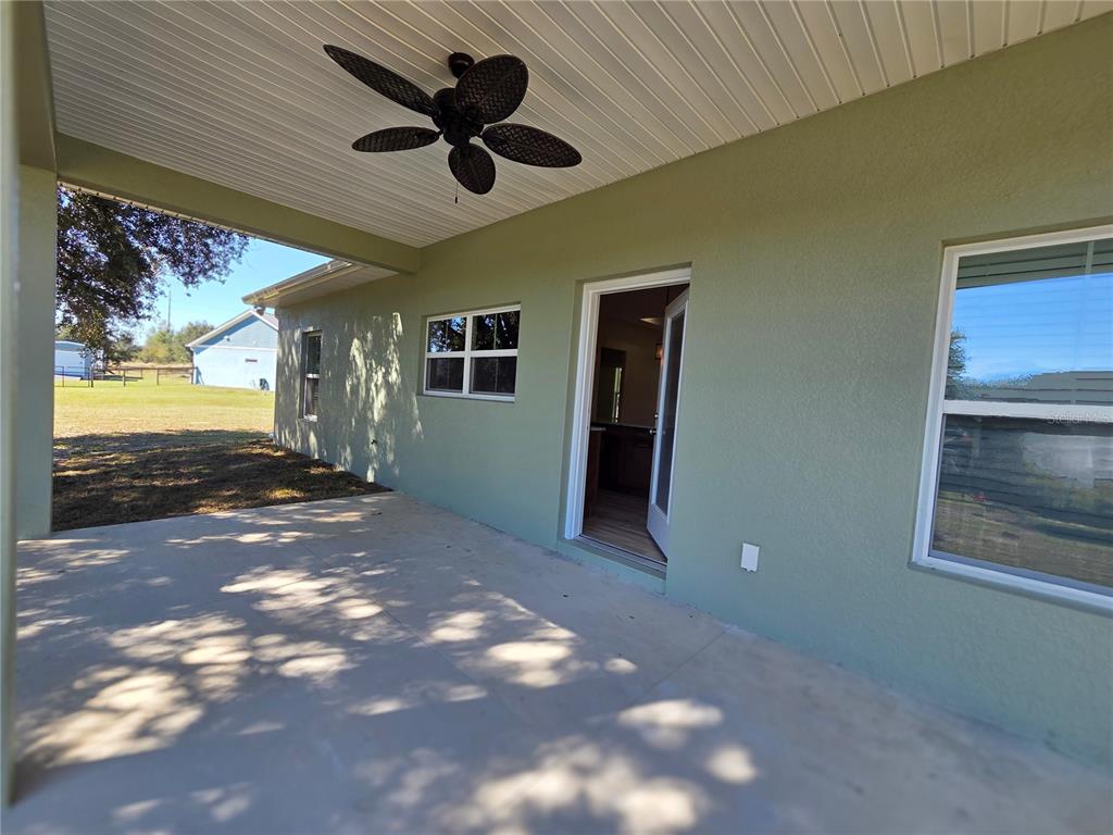 8005 North Terrel Point Citrus Springs, FL 34434 - Photo 34 of 41 a view of an empty room with a fireplace and a bookshelf