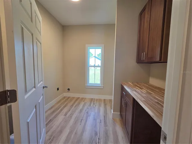 a spacious bathroom with a sink a mirror and a toilet