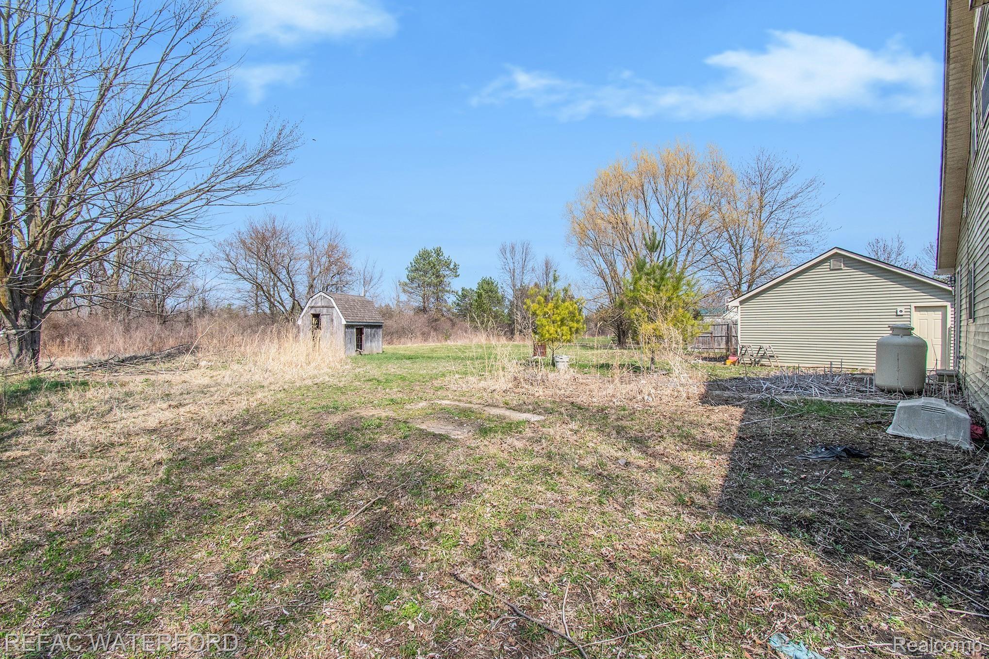 13604 Kimball Road Allenton, MI 48002 - Photo 19 of 32 View from door off laundry room to backyard.