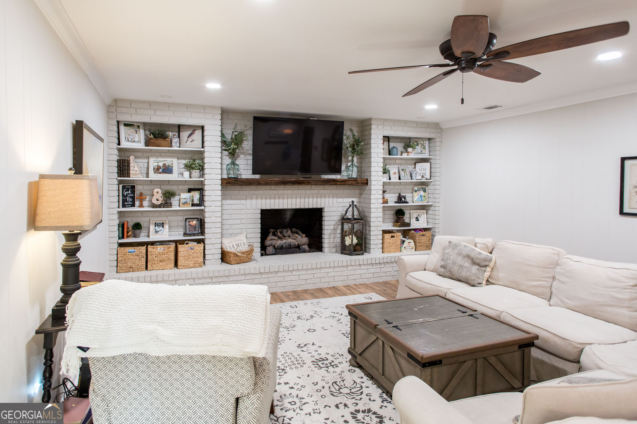 6737 Hacklebarney Road Blackshear, GA 31516 - Photo 19 of 40 a living room with furniture and a fireplace