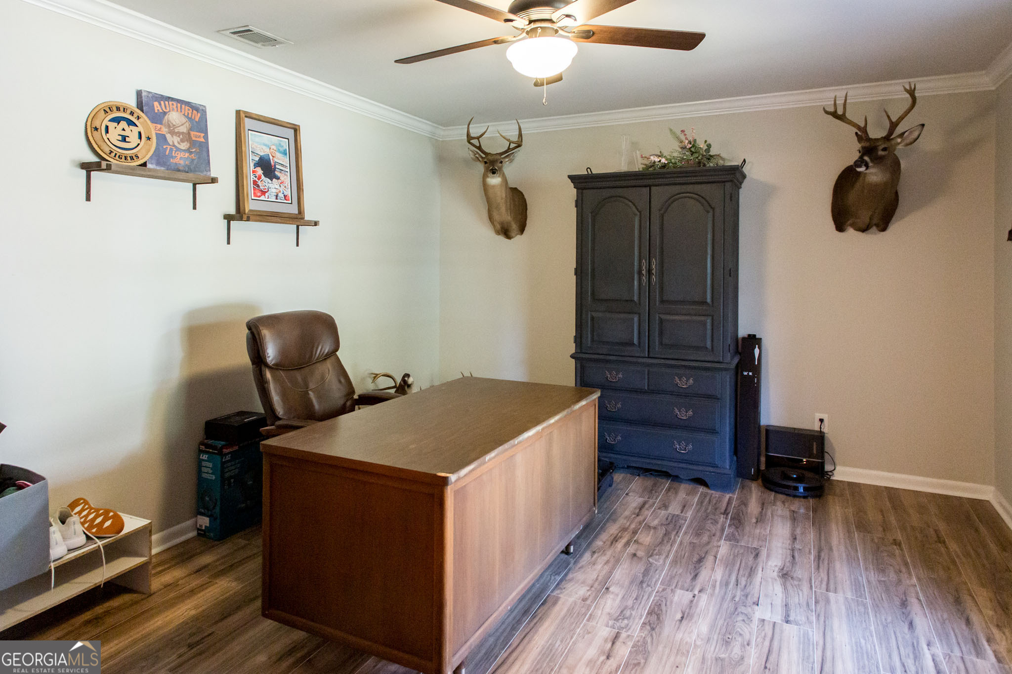 6737 Hacklebarney Road Blackshear, GA 31516 - Photo 20 of 40 a bedroom with a bed and wooden floor