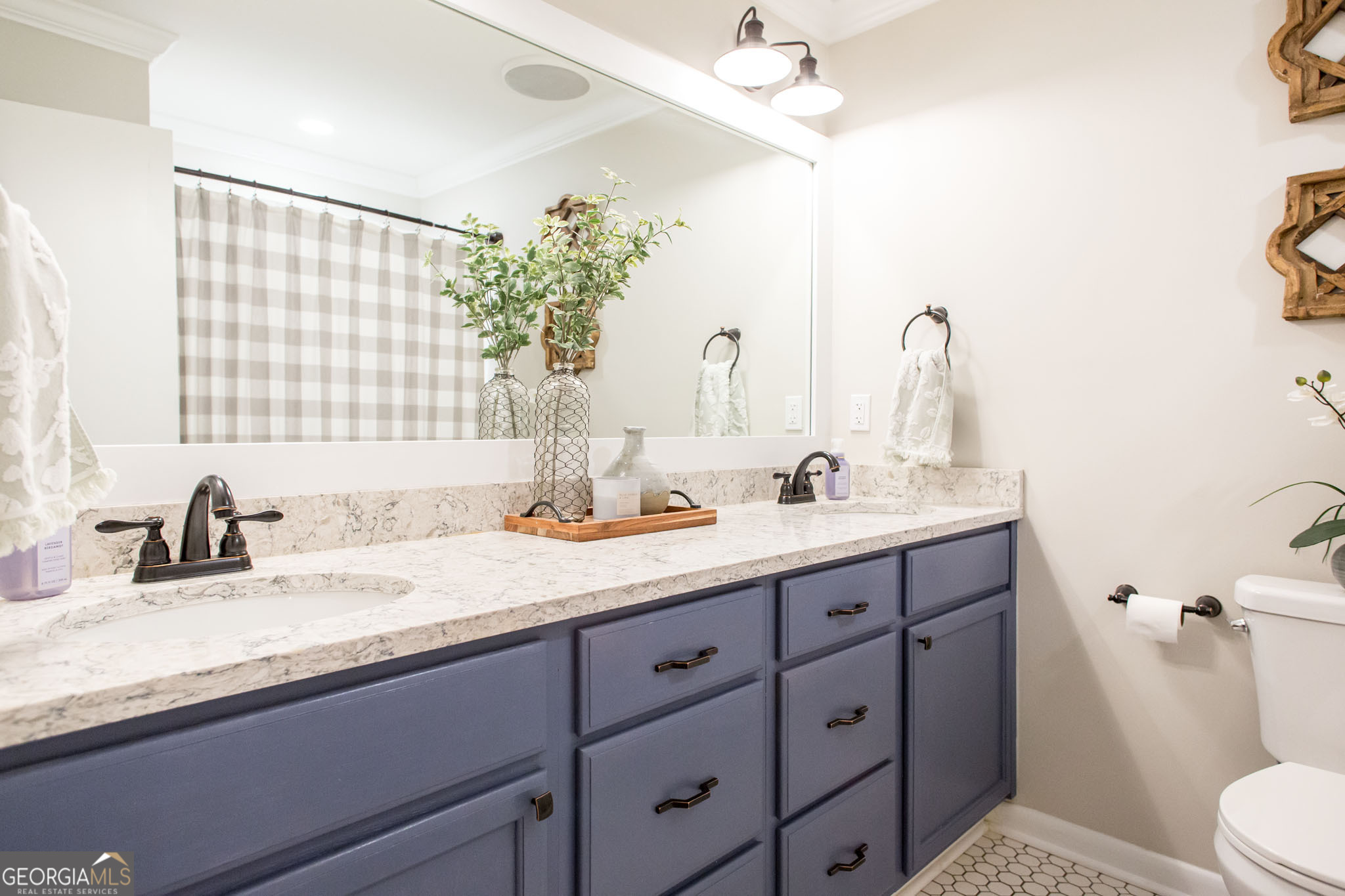 6737 Hacklebarney Road Blackshear, GA 31516 - Photo 25 of 40 a bathroom with a granite countertop sink a toilet and a mirror