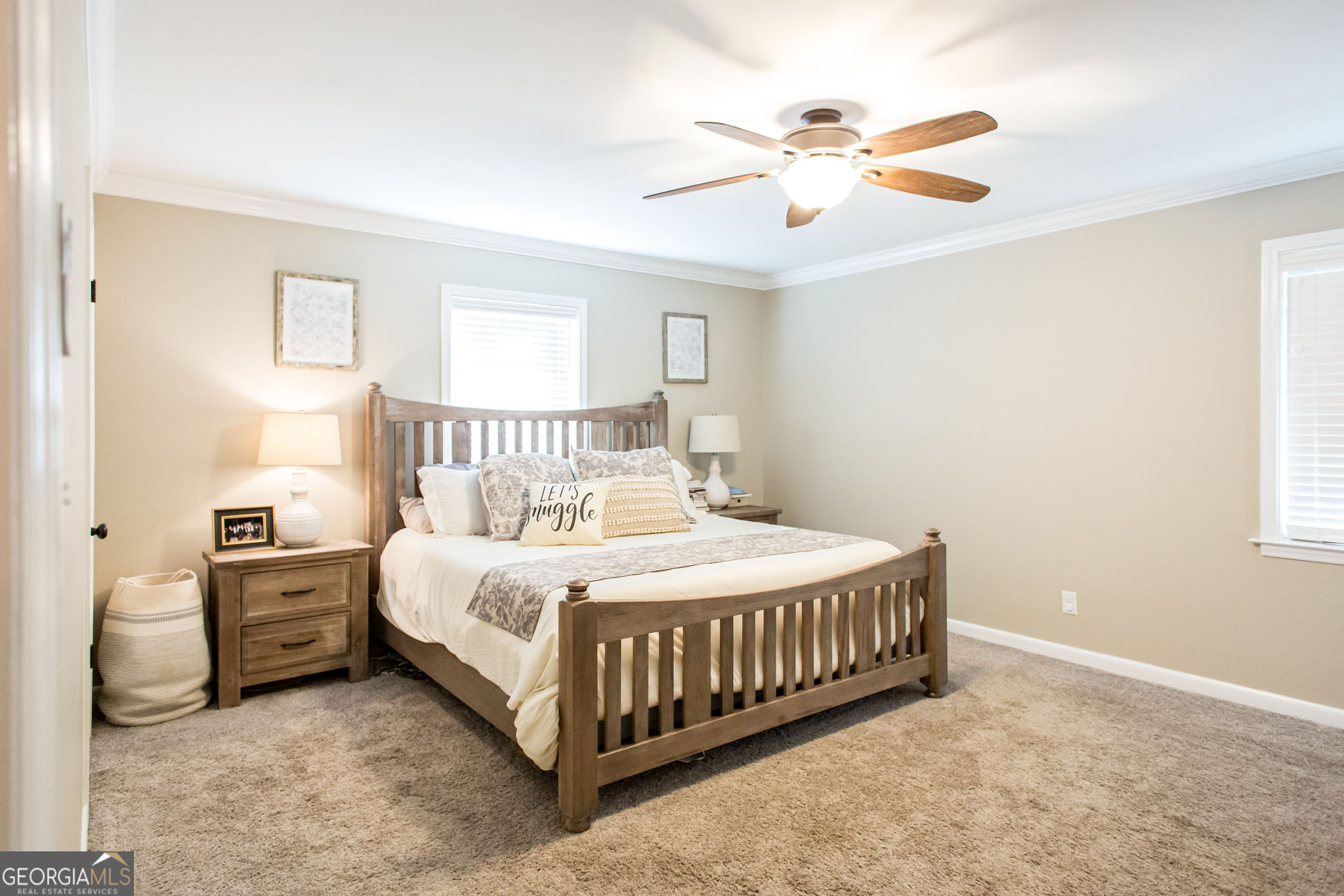 6737 Hacklebarney Road Blackshear, GA 31516 - Photo 30 of 40 a bedroom with a bed chandelier and a window