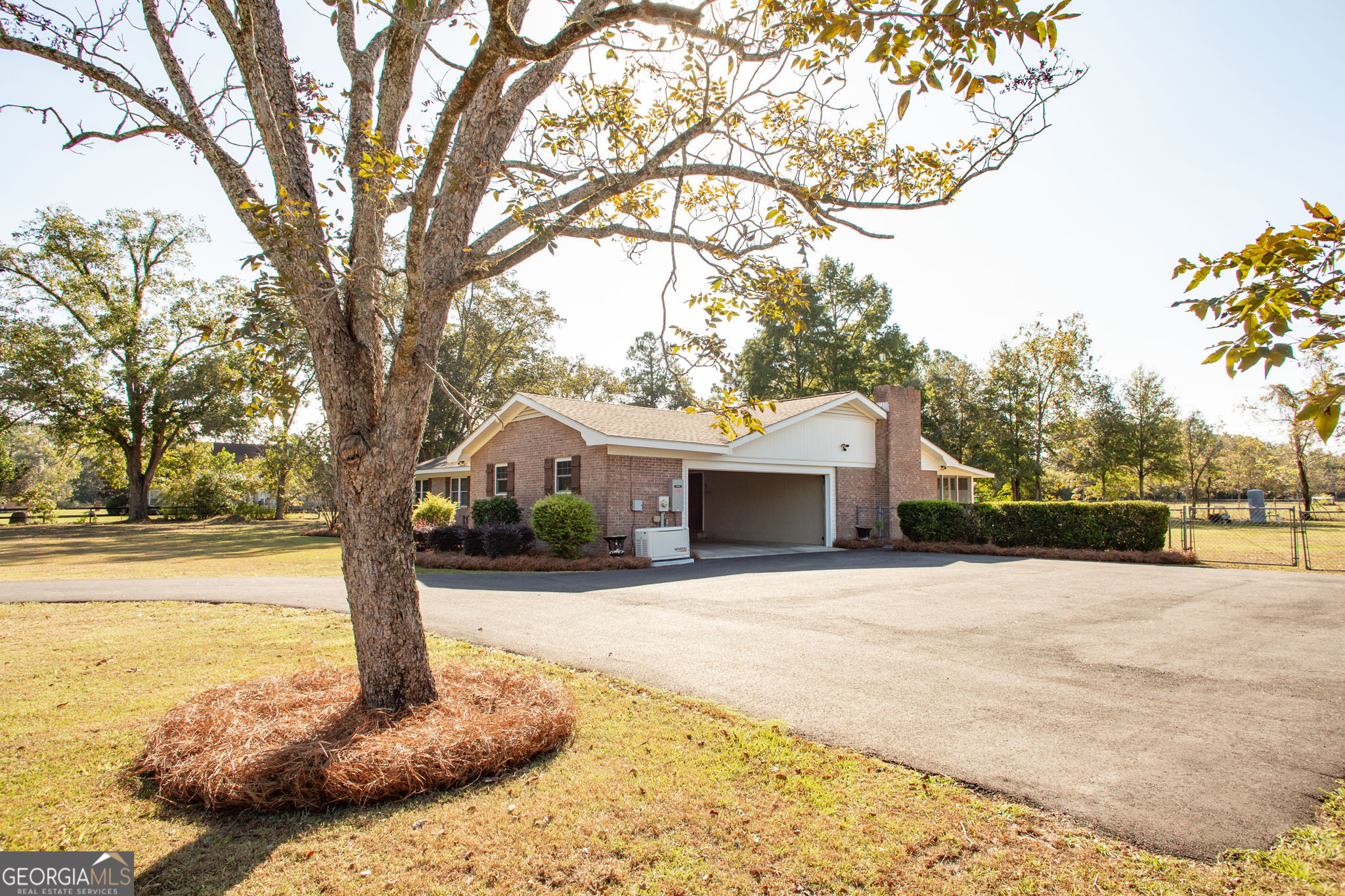 6737 Hacklebarney Road Blackshear, GA 31516 - Photo 4 of 40 a front view of a house with a yard