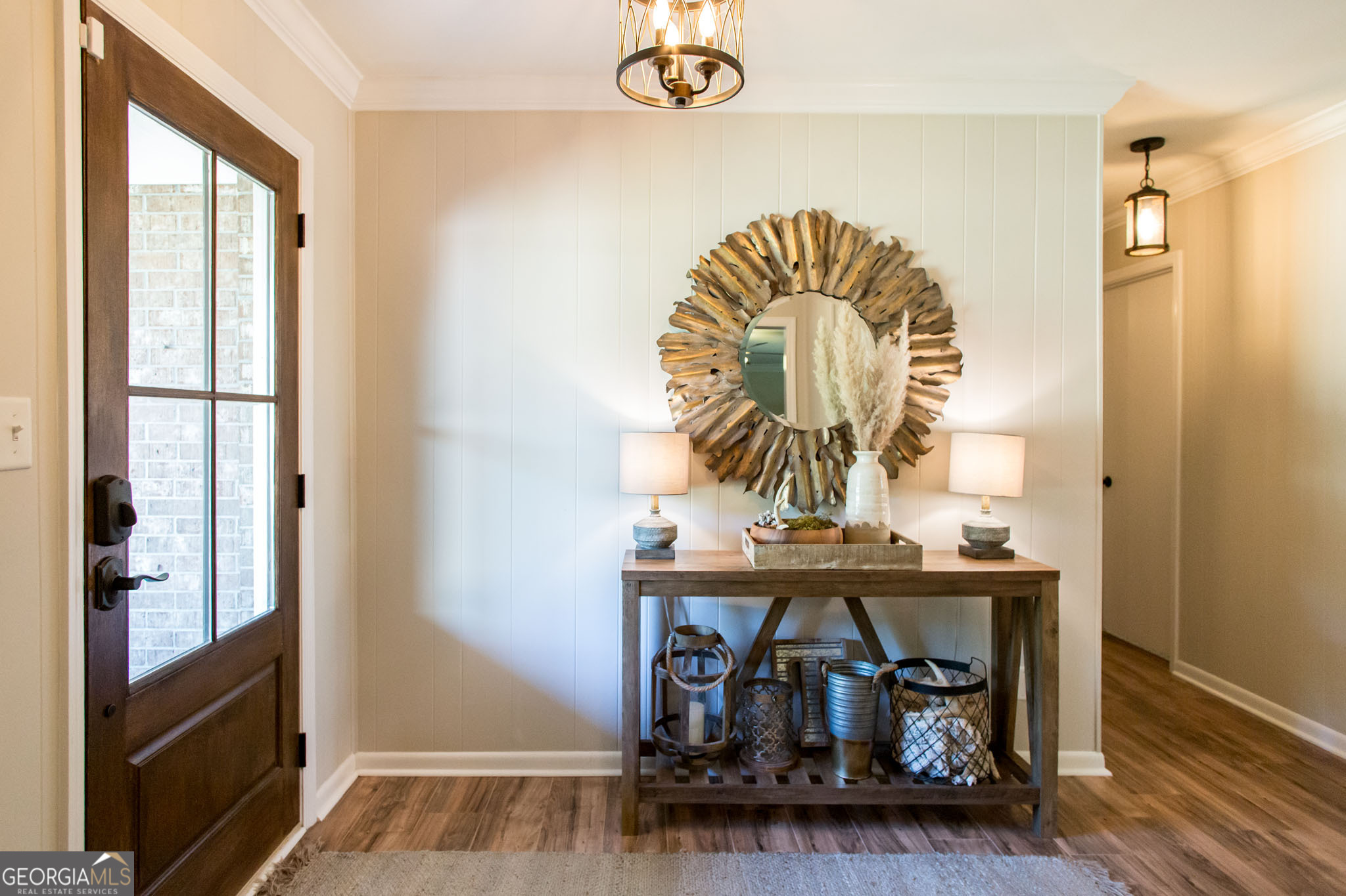 6737 Hacklebarney Road Blackshear, GA 31516 - Photo 6 of 40 a view of a hallway with wooden floor and front door