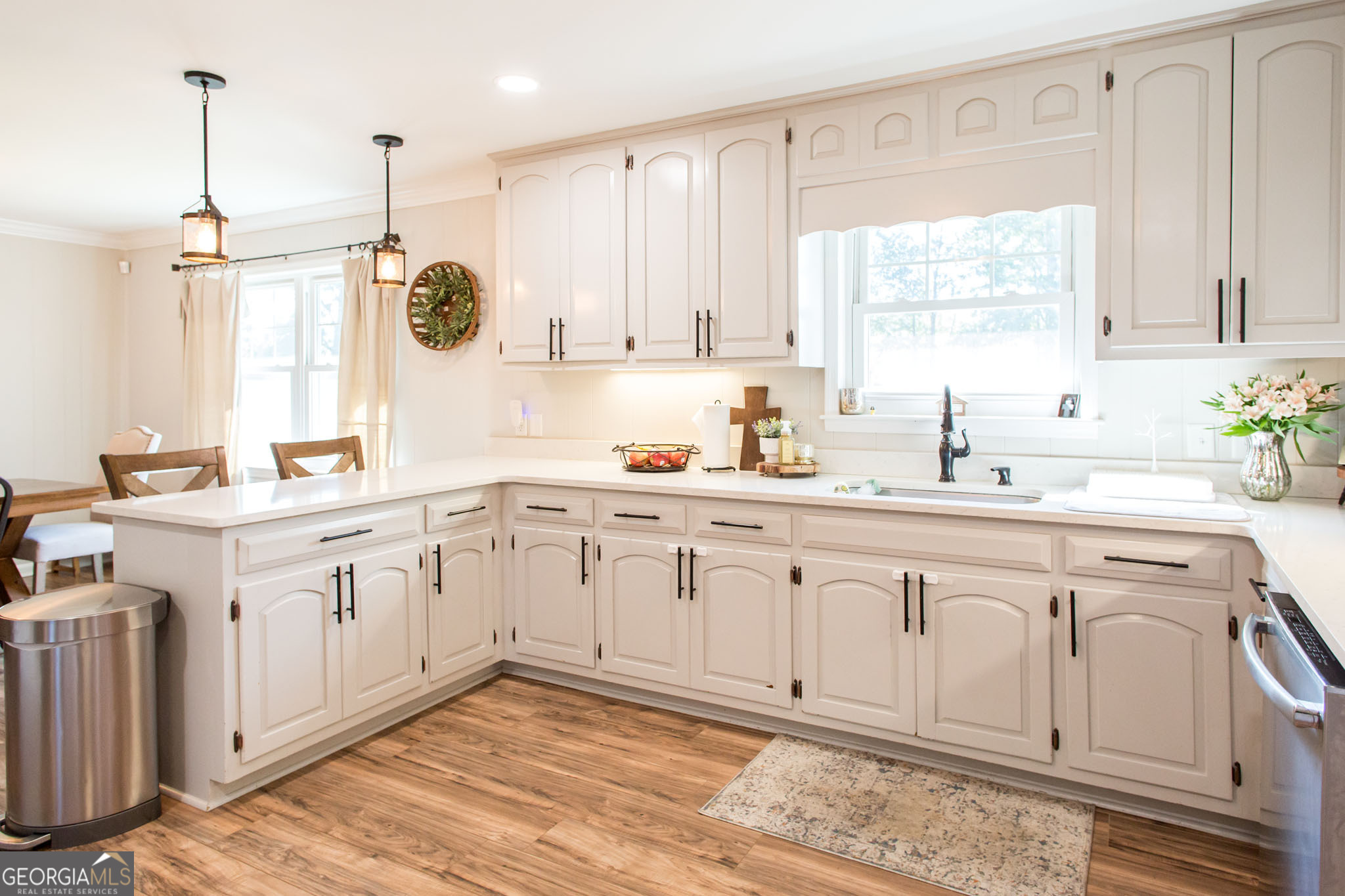 6737 Hacklebarney Road Blackshear, GA 31516 - Photo 8 of 40 a kitchen with a sink window and cabinets