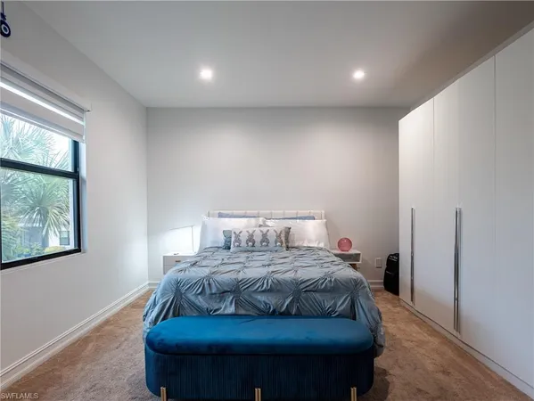 a bedroom with a bed and a desk