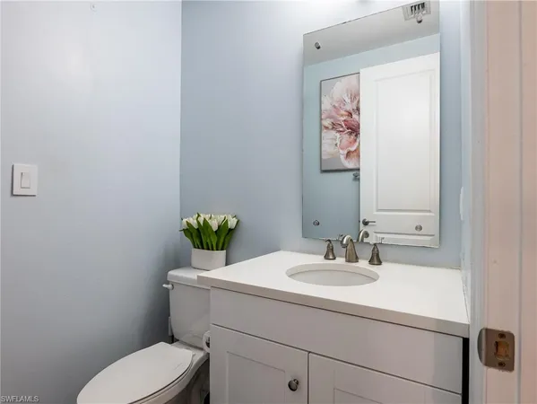 a bathroom with a toilet and a sink