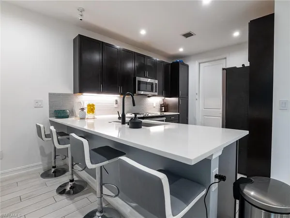 a living room with a bed and a couch