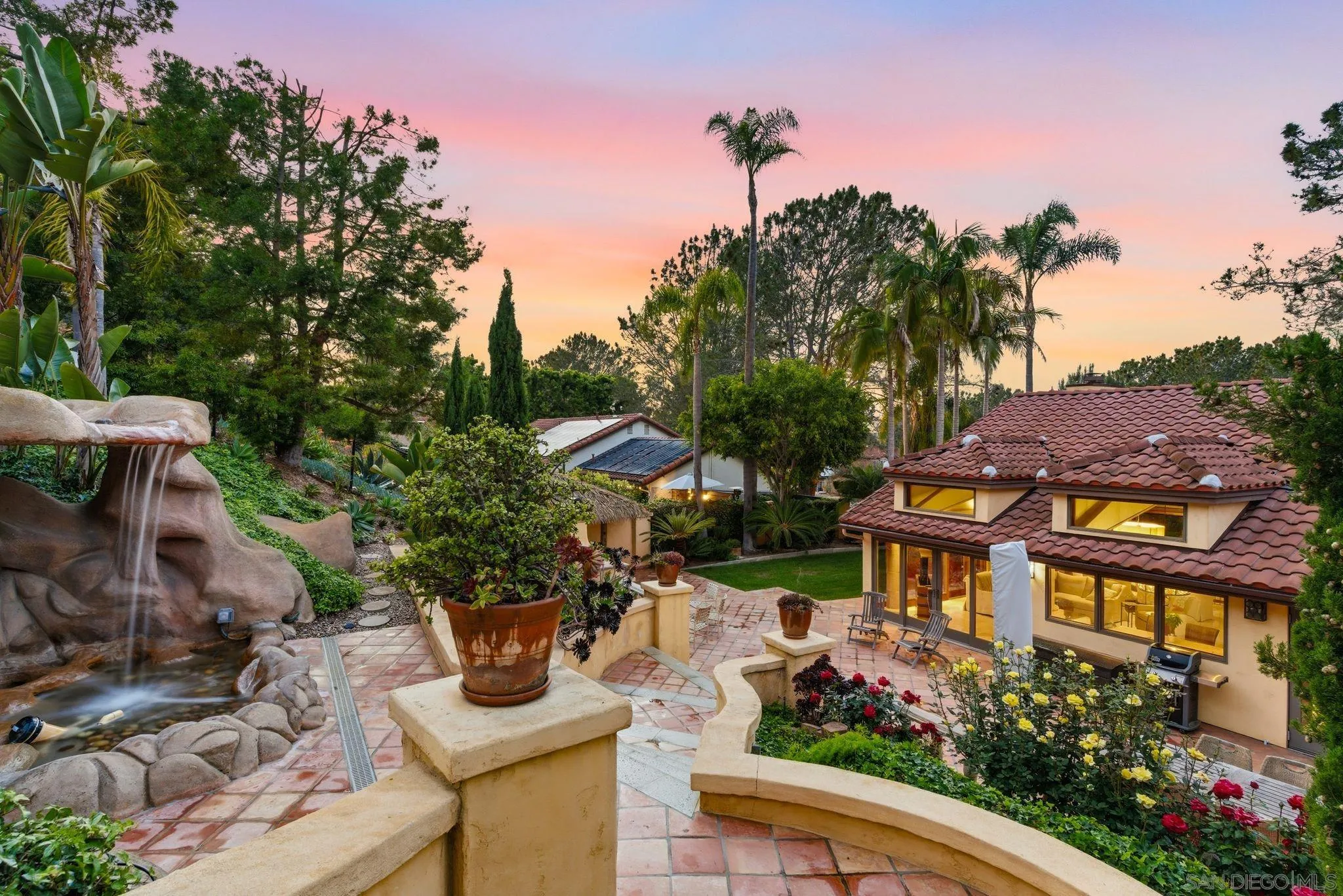 2969 Racetrack View Drive Del Mar, CA 92014 - Photo 1 of 59 a view of a garden with plants and a lake view