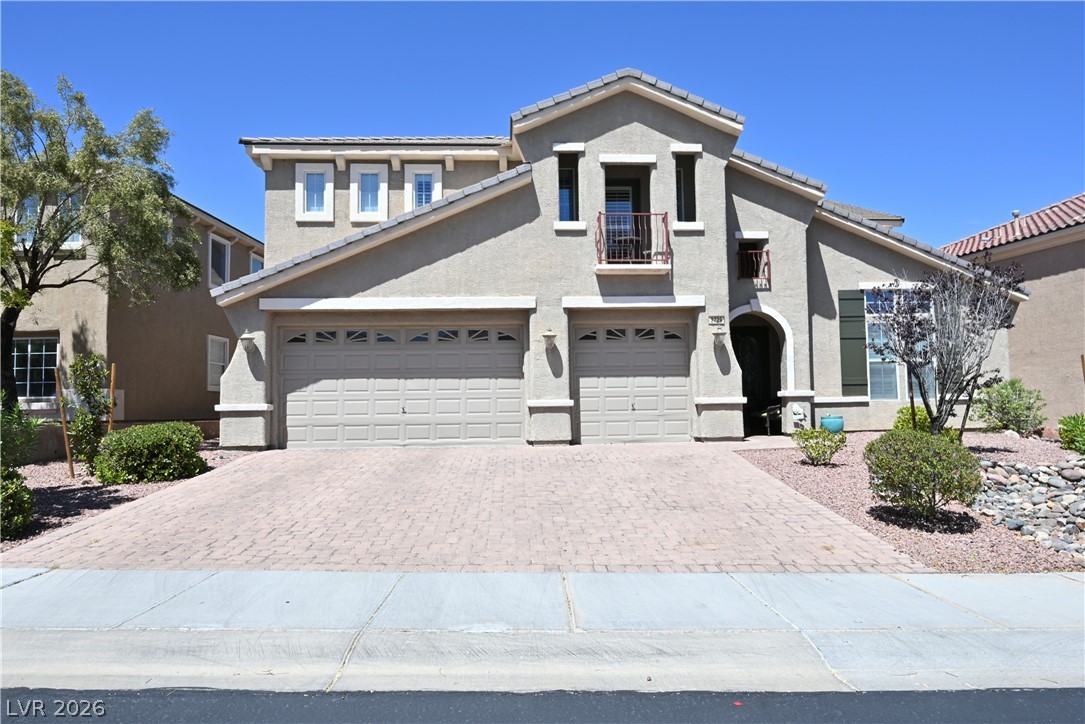2729 Kildrummie Street Henderson, NV 89044 - Photo 1 of 42 A well-maintained facade features an inviting driveway and mature landscaping under clear skies.
