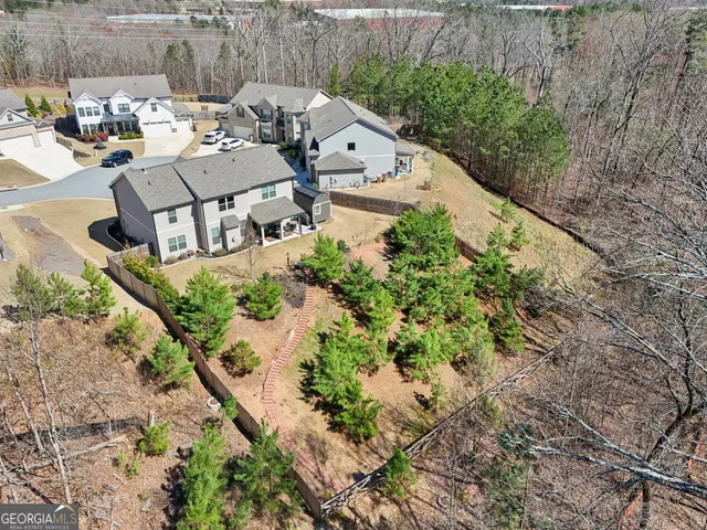 an aerial view of residential building and lake
