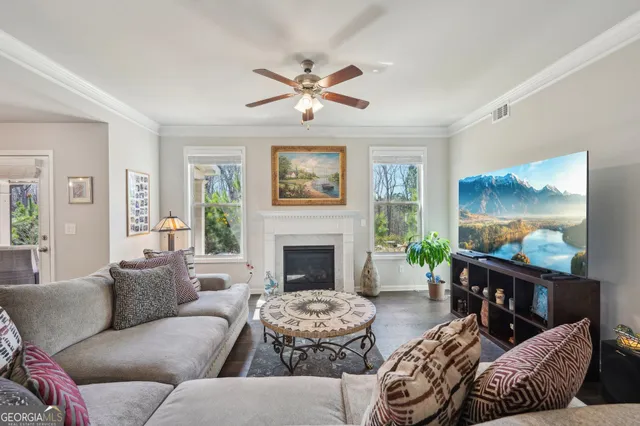 a living room with furniture fireplace and window