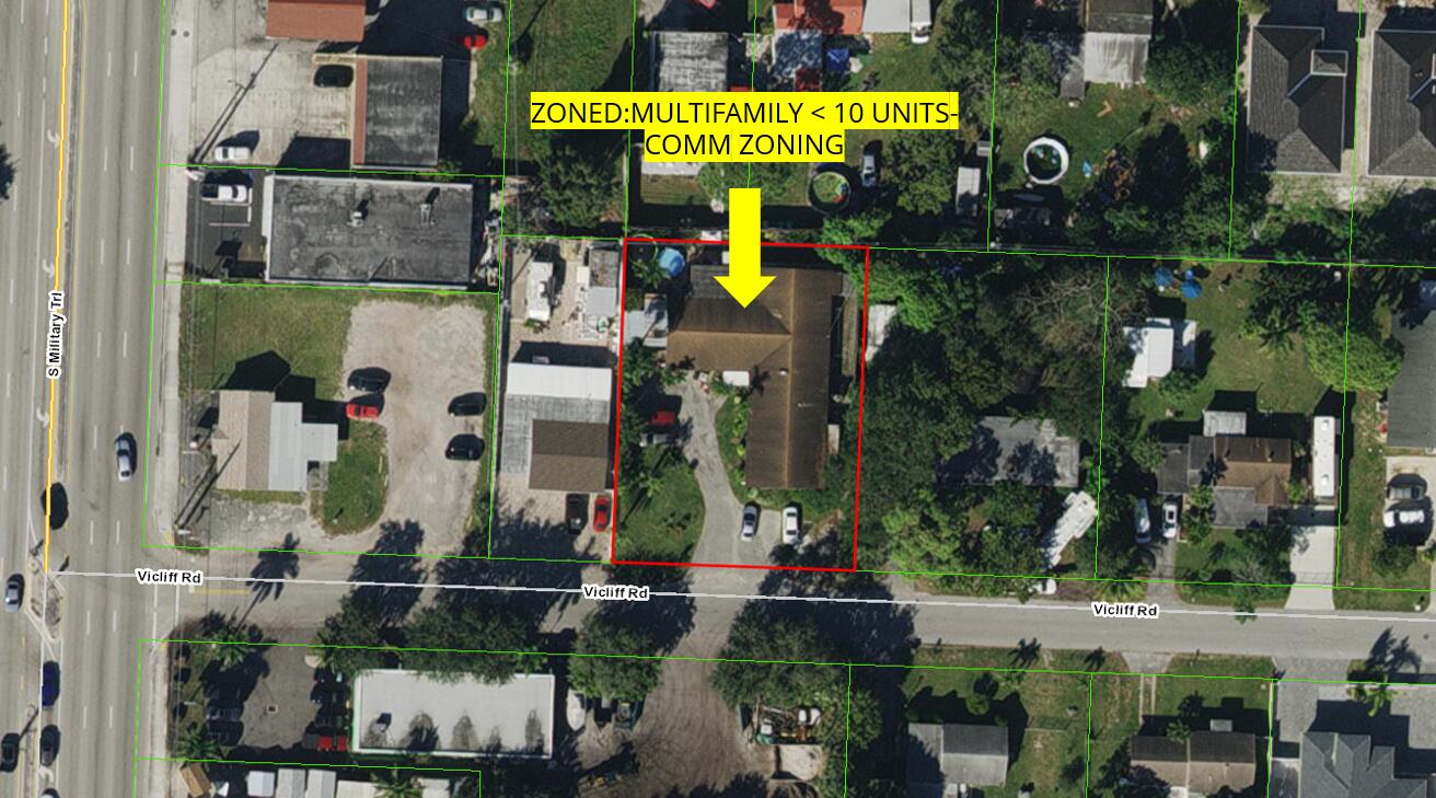 an aerial view of multiple houses with outdoor space