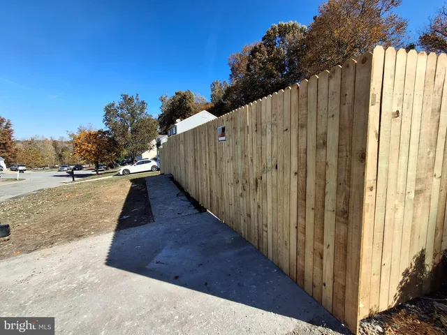 a view of a balcony with wooden fence