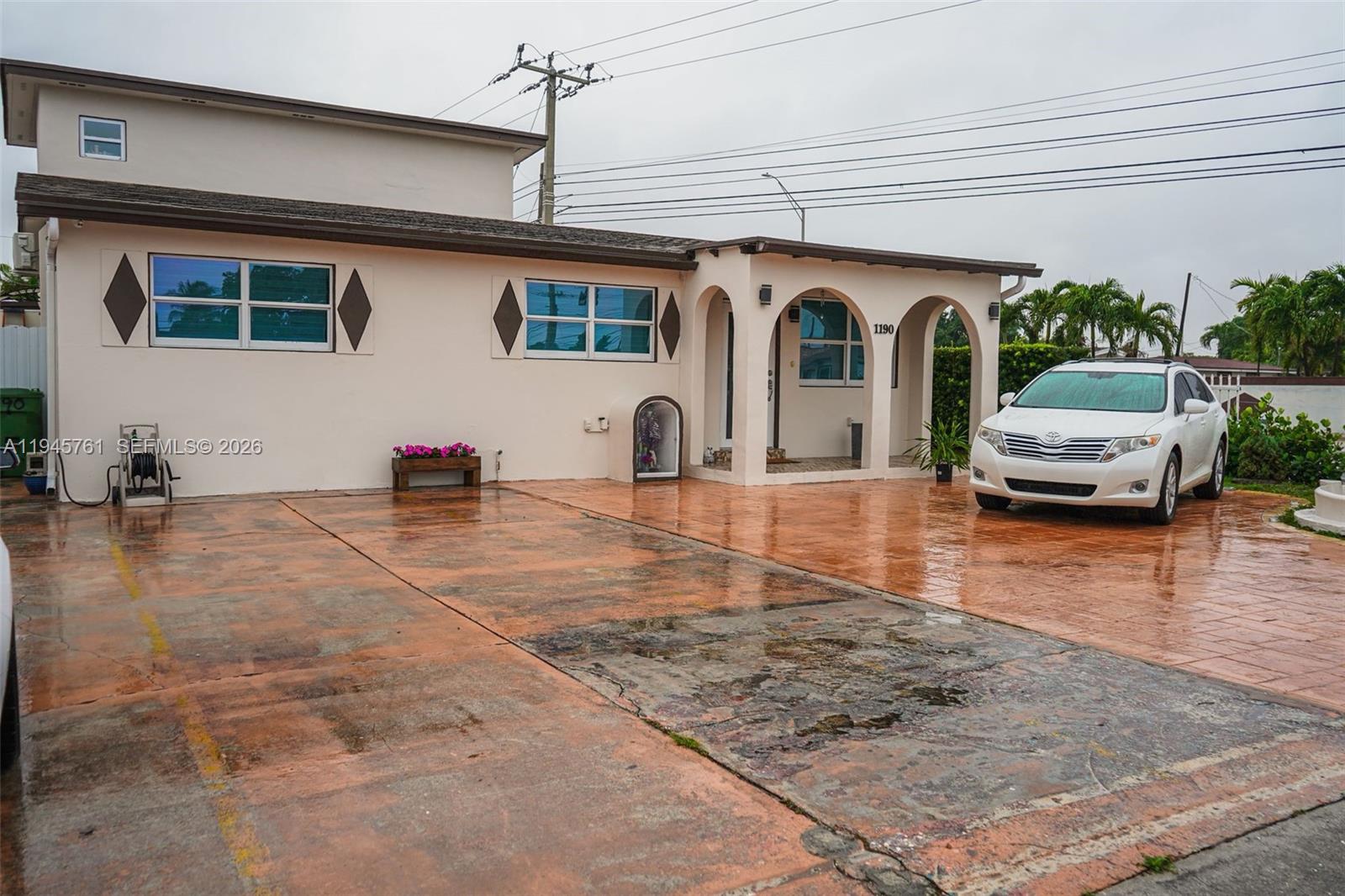 1190 West 33rd Street Hialeah, FL 33012 - Photo 11 of 54 a front view of a house with garden