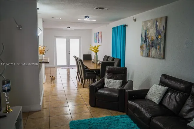 a kitchen with stainless steel appliances granite countertop a stove a microwave and cabinets