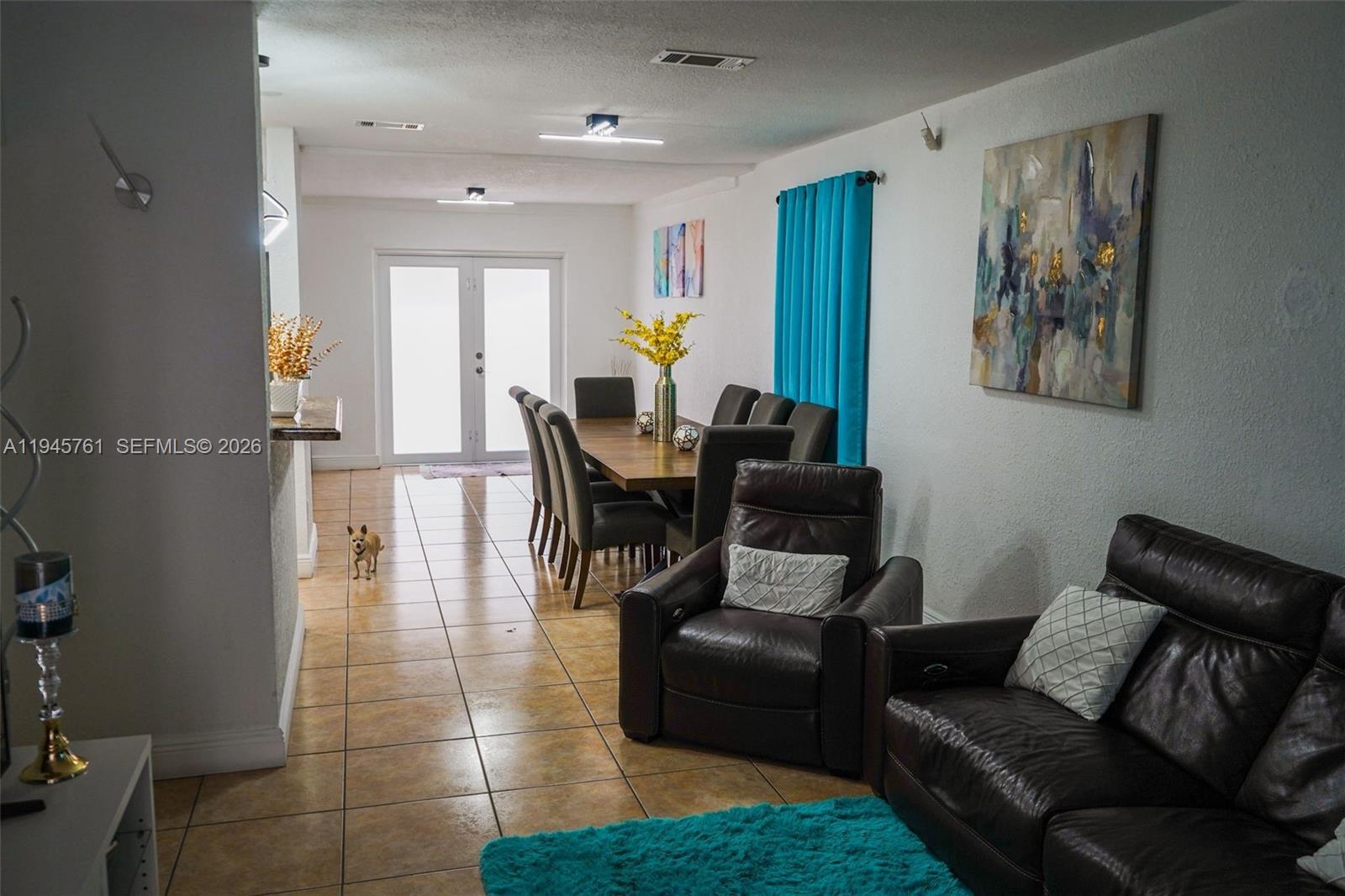 1190 West 33rd Street Hialeah, FL 33012 - Photo 14 of 54 a living room with furniture and wooden floor