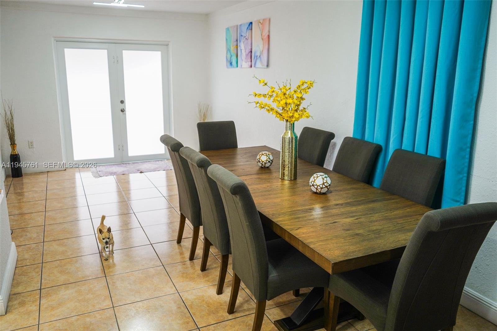 1190 West 33rd Street Hialeah, FL 33012 - Photo 19 of 54 a view of a dining room with furniture and a window