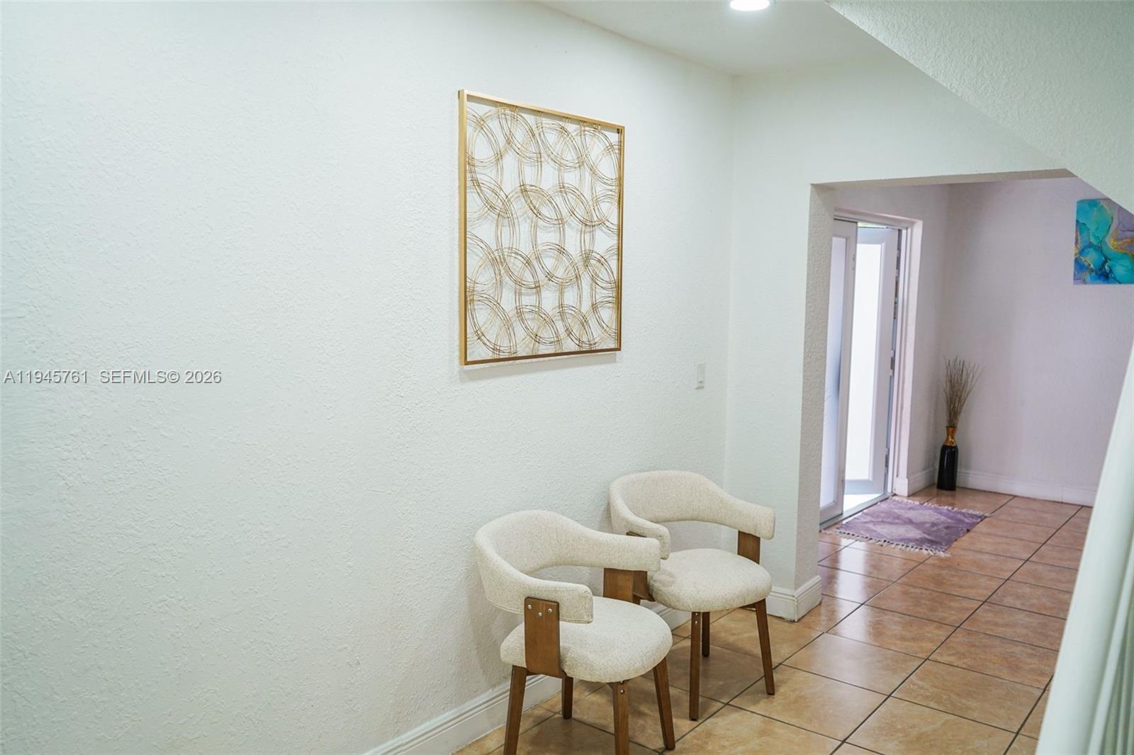 1190 West 33rd Street Hialeah, FL 33012 - Photo 21 of 54 a living room with furniture and a chair