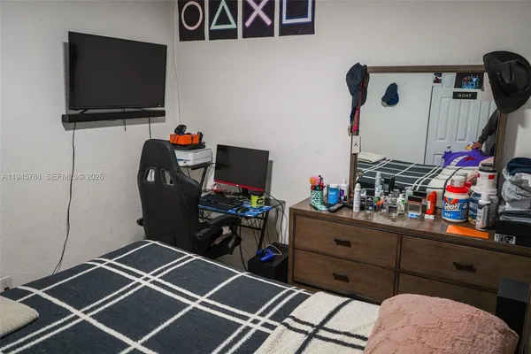 a room with furniture and a flat screen tv