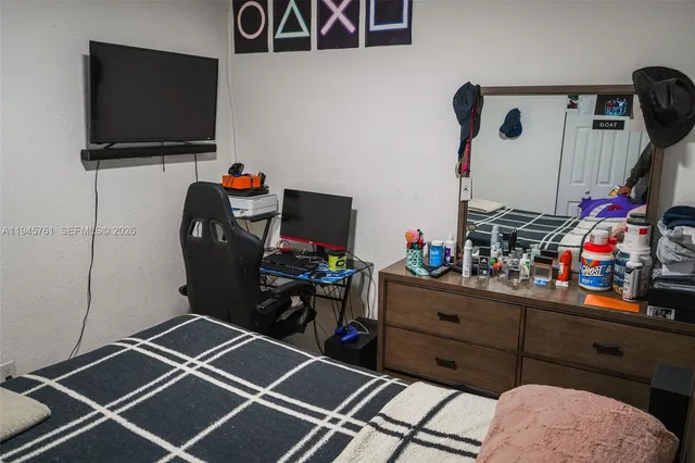 a room with furniture and a flat screen tv