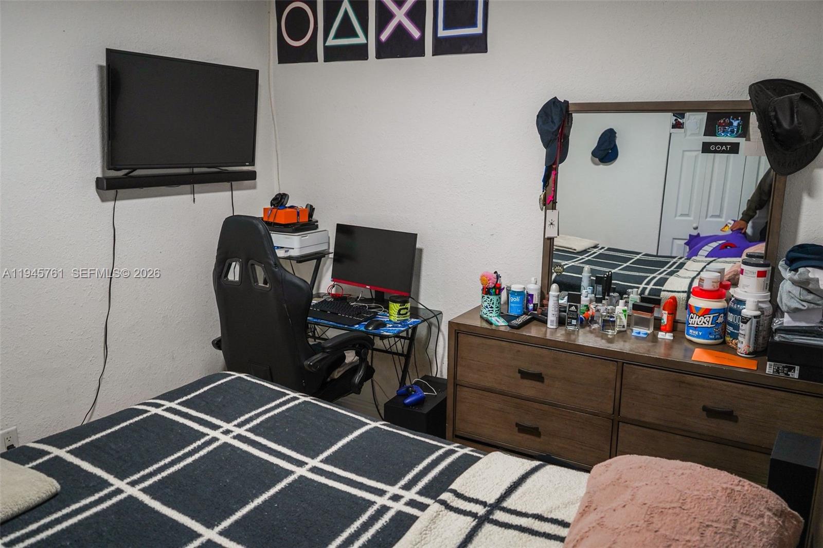 1190 West 33rd Street Hialeah, FL 33012 - Photo 27 of 54 a room with furniture and flat screen tv