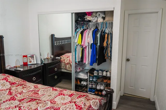a bathroom with a sink vanity and toilet